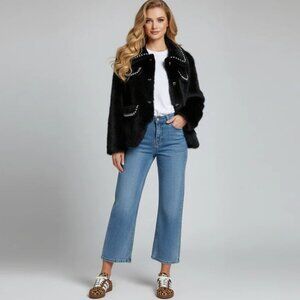 Fur coat with rhinestone trim and bow accents